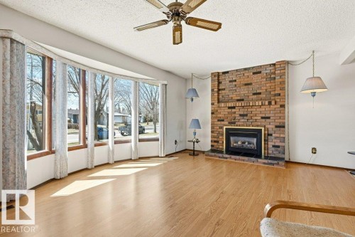 35 Oatway Drive, Stony Plain, AB - Indoor Photo Showing Living Room With Fireplace