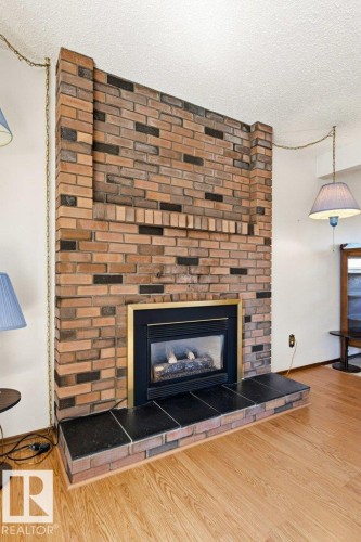 35 Oatway Drive, Stony Plain, AB - Indoor Photo Showing Living Room With Fireplace
