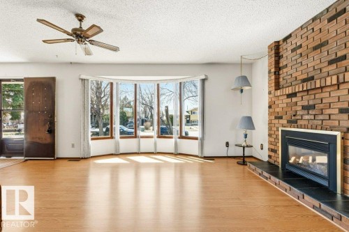 35 Oatway Drive, Stony Plain, AB - Indoor Photo Showing Living Room With Fireplace