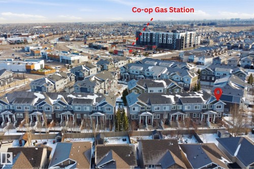 Townhome community featuring multi-story residences with gabled roofs and individual front entrances - 33 7385 Edgemont Way Nw, Edmonton, AB - Outdoor With View