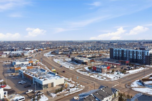 Expansive aerial perspective showcasing a residential and commercial area - 33 7385 Edgemont Way Nw, Edmonton, AB - Outdoor With View
