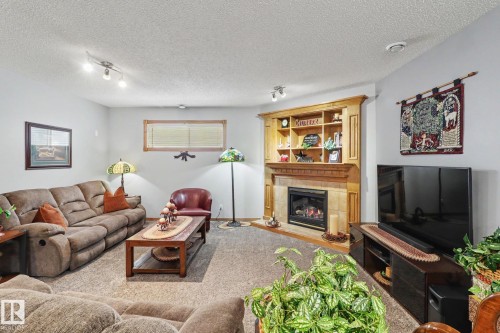 5 Richelieu Place, Beaumont, AB - Indoor Photo Showing Living Room With Fireplace