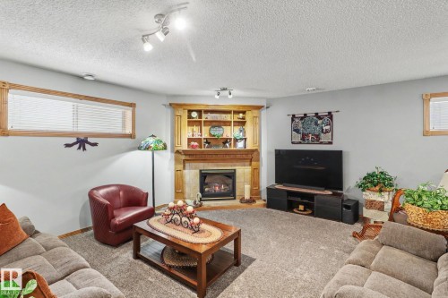 5 Richelieu Place, Beaumont, AB - Indoor Photo Showing Living Room With Fireplace