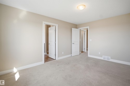 Neutral-toned walls complement plush carpeting - 19 15151 43 Street, Edmonton, AB - Indoor Photo Showing Other Room