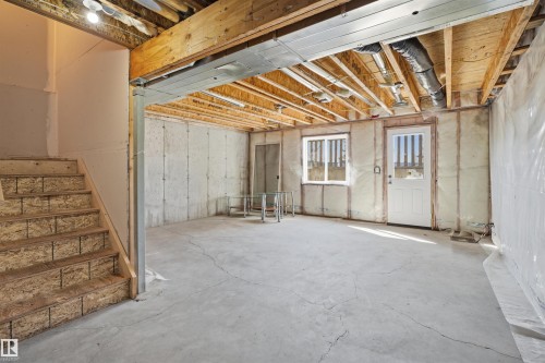 Unfinished basement with concrete flooring and exposed ceiling joists - 19 15151 43 Street, Edmonton, AB - Indoor Photo Showing Basement