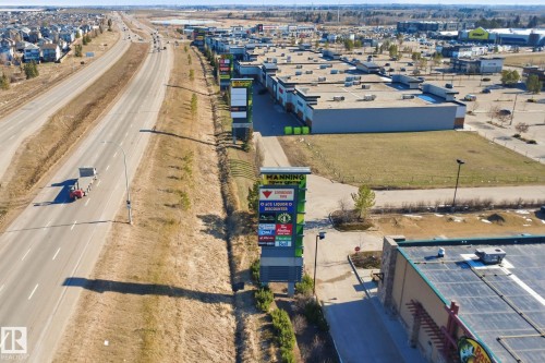 Aerial perspective showcasing a commercial development with multiple single-story buildings - 19 15151 43 Street, Edmonton, AB - Outdoor With View