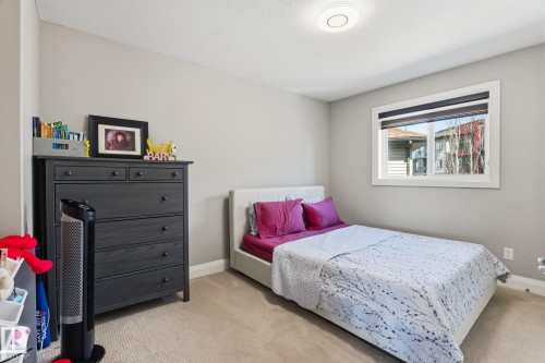 Carpeted bedroom with neutral wall tones - 731 57 Street Sw, Edmonton, AB - Indoor Photo Showing Bedroom