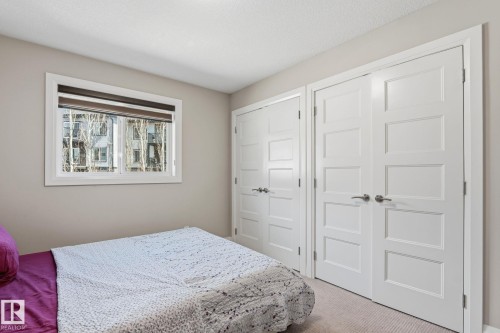 Neutral-toned wall paint and white trim - 731 57 Street Sw, Edmonton, AB - Indoor Photo Showing Bedroom