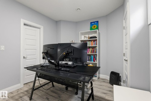 Room with light gray walls and wood-finish flooring - 731 57 Street Sw, Edmonton, AB - Indoor