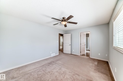 Carpeted interior room with light blue walls and white trim - 6723 19 Avenue, Edmonton, AB 