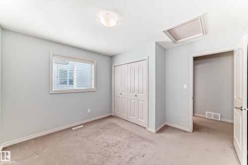 Room featuring light gray walls, carpet flooring, and white baseboards - 6723 19 Avenue, Edmonton, AB 