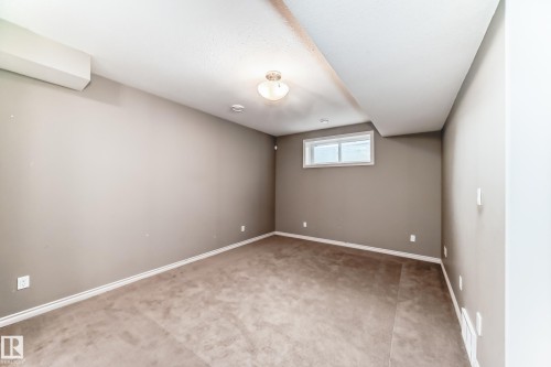 Carpeted room with neutral-toned walls - 6723 19 Avenue, Edmonton, AB 