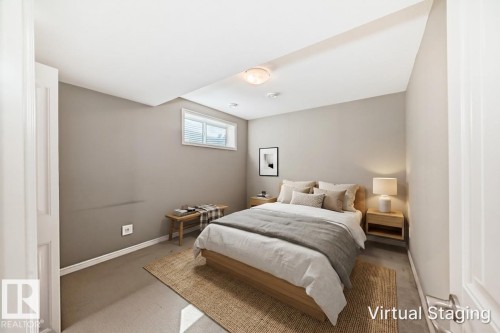 Carpeted room with a recessed ceiling, a single window with blinds, and a built-in ceiling light fixture - 6723 19 Avenue, Edmonton, AB 