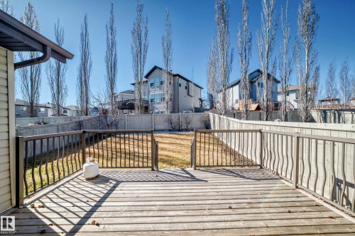 Expansive wood deck with dark-toned metal railings - 6723 19 Avenue, Edmonton, AB 