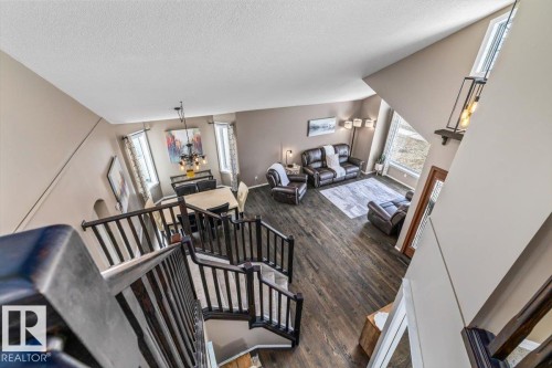Spacious interior featuring a multi-level design, dark wood-finish flooring, and high ceilings - 86 Westpark Way, Fort Saskatchewan, AB - Indoor