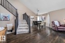 Open-concept living space featuring wood-finish flooring and a vaulted ceiling - 86 Westpark Way, Fort Saskatchewan, AB  - Indoor 
