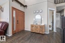 Wood-finish flooring throughout the entryway - 86 Westpark Way, Fort Saskatchewan, AB  - Indoor 