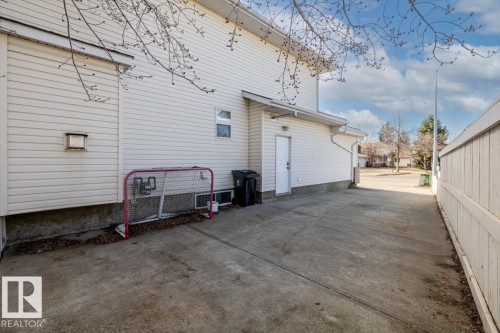 Side exterior with white vinyl siding - 86 Westpark Way, Fort Saskatchewan, AB - Outdoor With Exterior