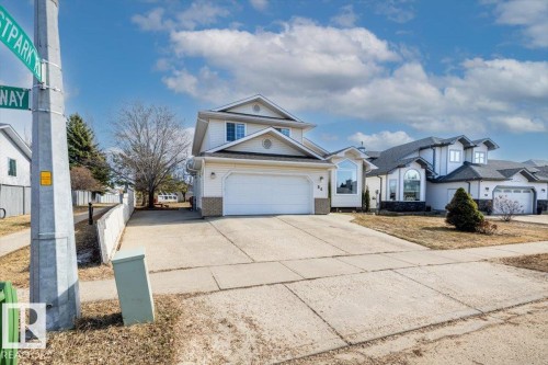 Two-story residence with a two-car garage and concrete driveway - 86 Westpark Way, Fort Saskatchewan, AB - Outdoor With Facade
