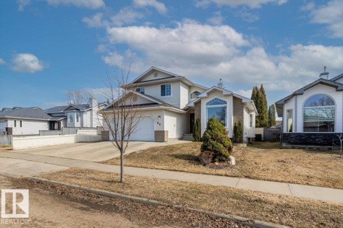 Two-story residence featuring light-colored siding and a contrasting roof - 86 Westpark Way, Fort Saskatchewan, AB - Outdoor With Facade