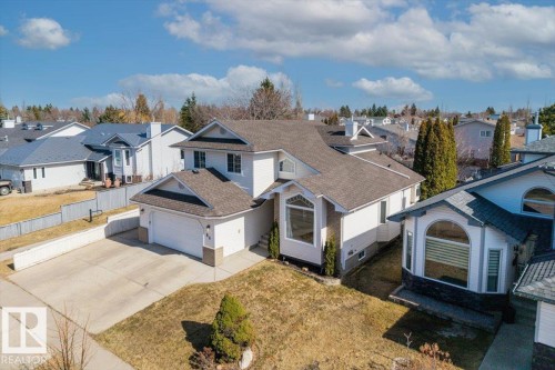 Contemporary multi-level residence featuring a two-car garage, contrasting roof lines, and a prominent bay window - 86 Westpark Way, Fort Saskatchewan, AB - Outdoor