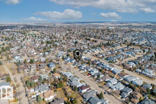 Aerial perspective highlighting a residential neighborhood with numerous single-family homes and established streets - 86 Westpark Way, Fort Saskatchewan, AB - Outdoor With View