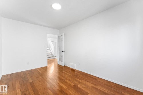Room featuring wood-finish flooring and white walls - 326 Silver Berry Road, Edmonton, AB - Indoor Photo Showing Other Room