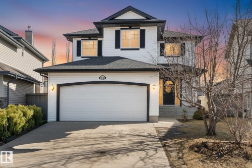 Modern two-story residence featuring a white siding exterior with dark trim accents - 326 Silver Berry Road, Edmonton, AB - Outdoor