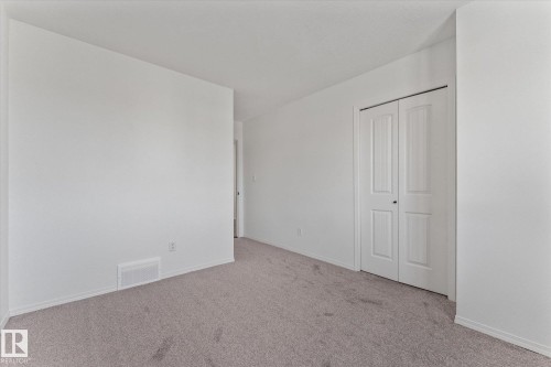 Neutral wall paint with carpet flooring - 326 Silver Berry Road, Edmonton, AB - Indoor Photo Showing Other Room
