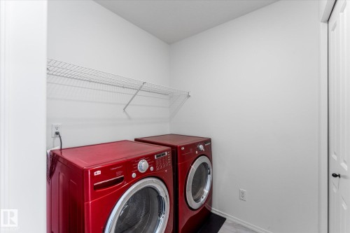 Dedicated laundry area featuring a wire shelving unit - 326 Silver Berry Road, Edmonton, AB - Indoor Photo Showing Laundry Room
