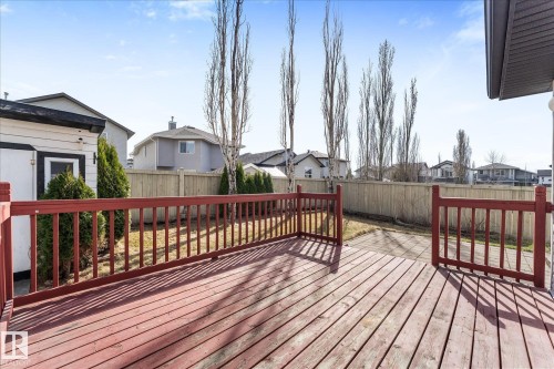 Spacious wood-finish deck with red railings - 326 Silver Berry Road, Edmonton, AB - Outdoor With Deck Patio Veranda