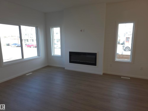 43 Eton Link, Spruce Grove, AB - Indoor Photo Showing Living Room With Fireplace