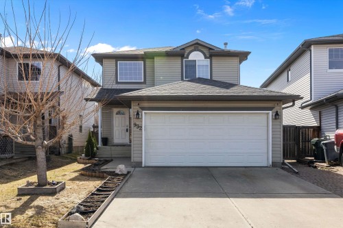 Two-story residence featuring light gray siding and a dark shingle roof - 992 Regency Drive, Sherwood Park, AB - Outdoor