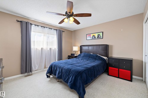 Bedroom featuring light-colored carpet flooring and neutral-toned walls - 992 Regency Drive, Sherwood Park, AB - Indoor Photo Showing Bedroom