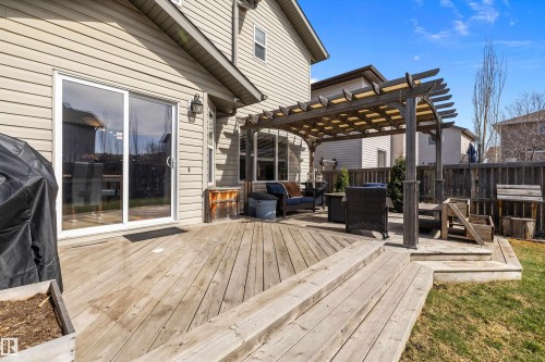 Multi-level wood deck featuring a pergola structure and direct access via sliding glass doors - 992 Regency Drive, Sherwood Park, AB - Outdoor With Deck Patio Veranda With Exterior