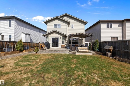 Rear exterior featuring a multi-level wood deck, a pergola, and a sliding glass door - 992 Regency Drive, Sherwood Park, AB - Outdoor With Deck Patio Veranda With Exterior