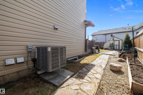 Exterior siding featuring a central air conditioning unit on a concrete pad - 992 Regency Drive, Sherwood Park, AB - Outdoor With Exterior