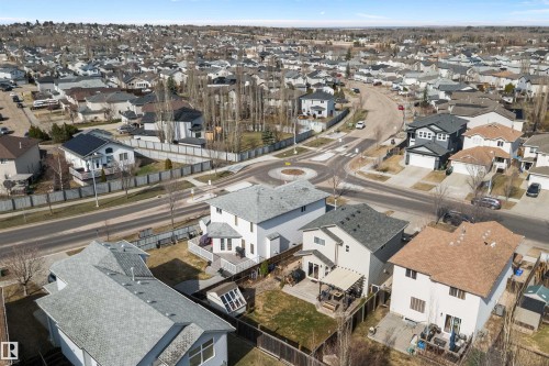 Aerial perspective of a residential neighborhood featuring detached homes with varied architectural styles and roofing materials - 992 Regency Drive, Sherwood Park, AB - Outdoor With View