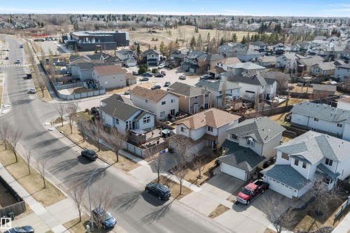 Residential neighborhood featuring a variety of detached homes with attached garages, paved streets, and sidewalks - 992 Regency Drive, Sherwood Park, AB - Outdoor With View