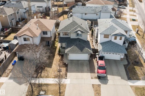 Contemporary two-story residence with light gray siding and an attached single-car garage - 992 Regency Drive, Sherwood Park, AB - Outdoor With Facade