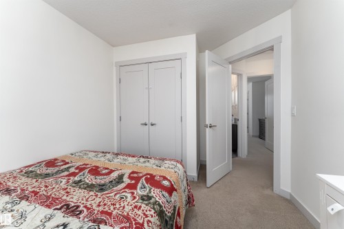 Neutral color palette throughout, featuring light beige carpeting and white walls - 15 5203 149 Avenue, Edmonton, AB - Indoor Photo Showing Bedroom