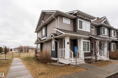 Two-story townhome with multi-tone vinyl siding and gabled rooflines - 15 5203 149 Avenue, Edmonton, AB - Outdoor With Facade