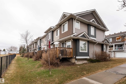 Contemporary two-story townhouse with multi-tone siding and a gabled roofline - 15 5203 149 Avenue, Edmonton, AB - Outdoor