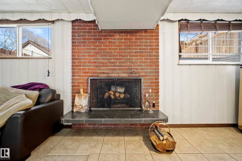 8946 80 Avenue, Edmonton, AB - Indoor Photo Showing Living Room With Fireplace