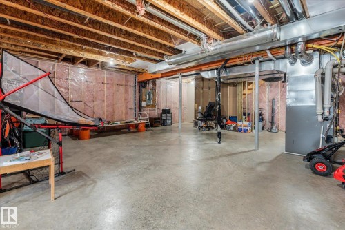 Unfinished basement featuring exposed wood joists, concrete flooring, and insulated perimeter walls - 41 Heron Crescent, Spruce Grove, AB - Indoor Photo Showing Basement