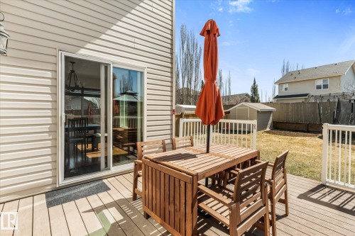 Expansive exterior deck featuring composite decking and white railings - 41 Heron Crescent, Spruce Grove, AB - Outdoor With Deck Patio Veranda With Exterior