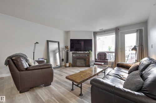 304 6220 Fulton Road, Edmonton, AB - Indoor Photo Showing Living Room With Fireplace