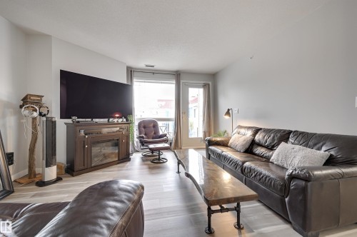 304 6220 Fulton Road, Edmonton, AB - Indoor Photo Showing Living Room With Fireplace