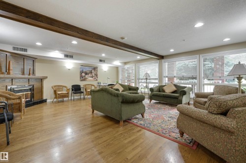 304 6220 Fulton Road, Edmonton, AB - Indoor Photo Showing Other Room With Fireplace