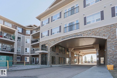 Multi-story residential building featuring a stone and siding exterior - 201 1520 Hammond Gate Gate, Edmonton, AB - Outdoor